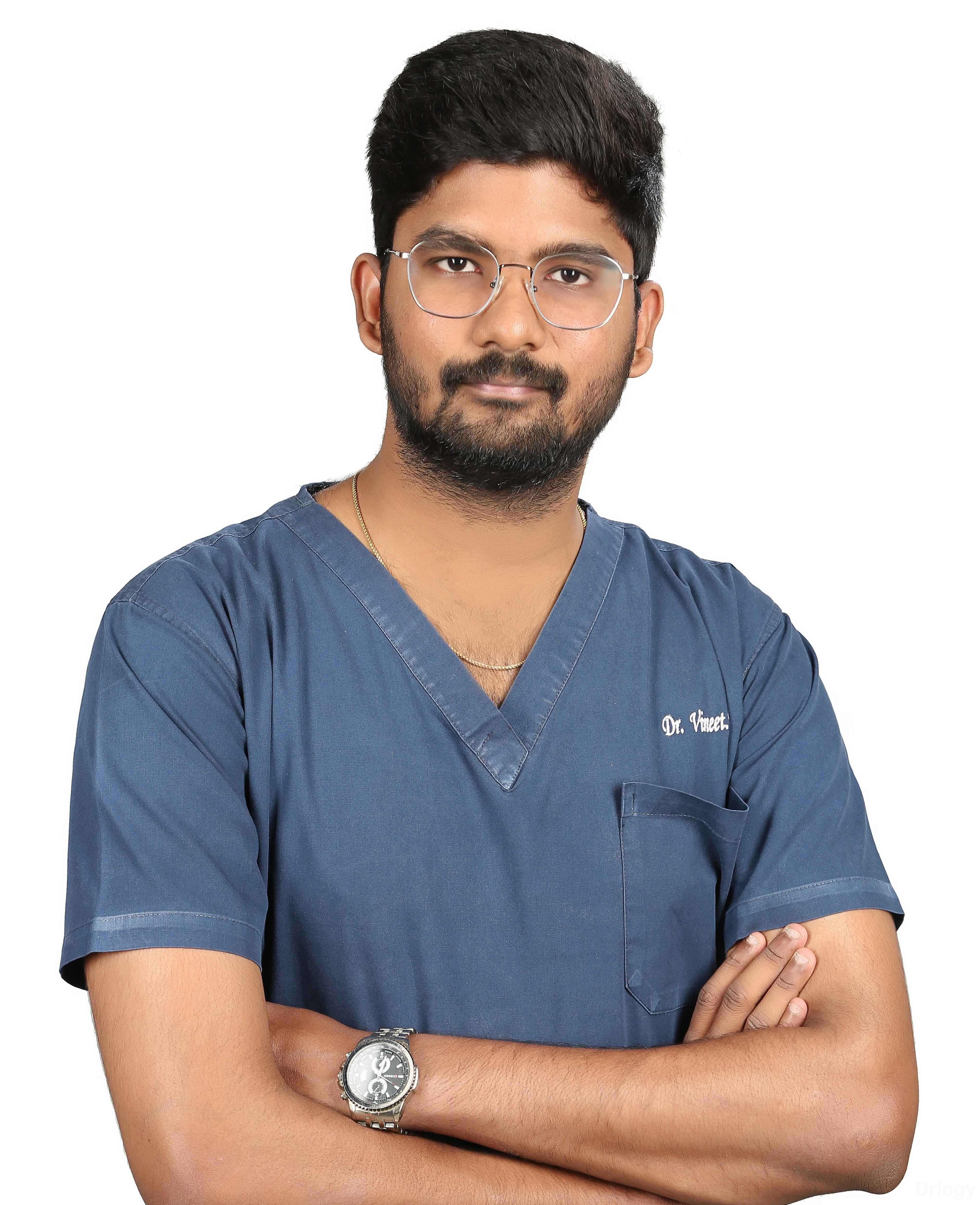 Dr. VINEET V